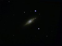 M102  Spindle Galaxy in Draco. Taken at home on 06/20/06, 06/22/06 and 06/23/06.  Meade RCX400 10" scope, DSI-Pro camera. L data at 10 seconds/frame, 746 images. RGB data at 20 seconds/image, 60:210:131 images respectively. Total time 4.3 hours.
