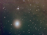 M32  Dwarf elliptical galaxy, a satellite of the Andromeda Galaxy (M31), which is responsible for the glow in upper part of the picture. Taken at home on 12/17/06.  Meade RCX400 10" scope, DSI-Pro camera. 10 seconds/frame, total time 140 minutes (RGB=40:40:60),