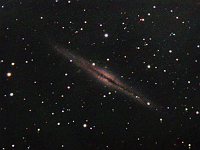 NGC 891  Galaxy in Andromeda. Taken at home on 12/03/06.  Meade RCX400 10" scope, DSI-Pro camera. 10 seconds/frame, total time 140 minutes (RGB = 40:40:60).
